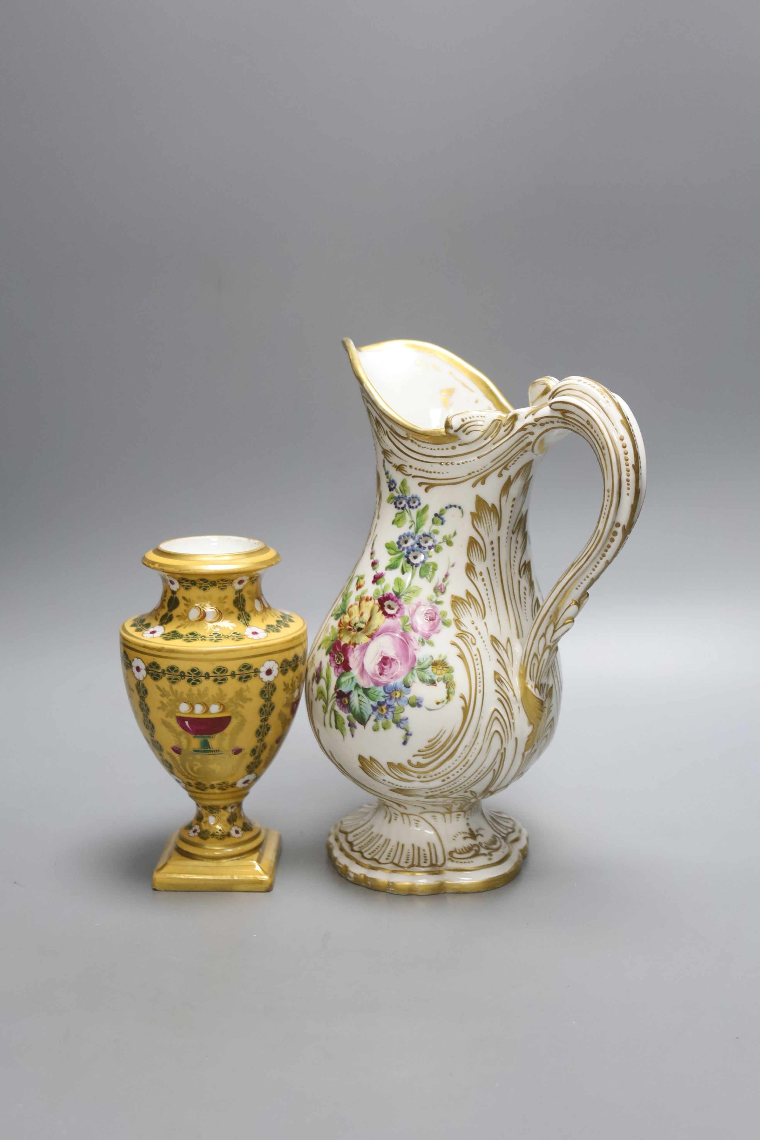 A 19th century Sevres floral and gilt painted jug and vase, tallest 24cm